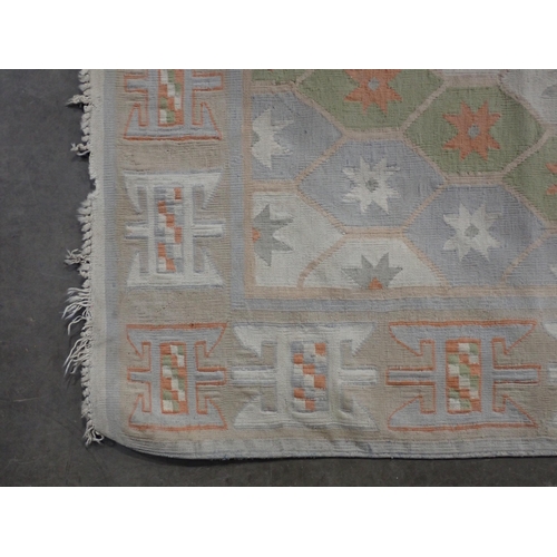 41 - A Kelim Rug on cream ground with geometric border and large central diamond motif, A/F. 7ft 4