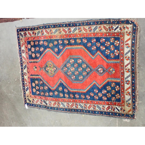 43 - A Kazak style Rug on blue ground with multi borders and large central motif and geometric designs, 5... 