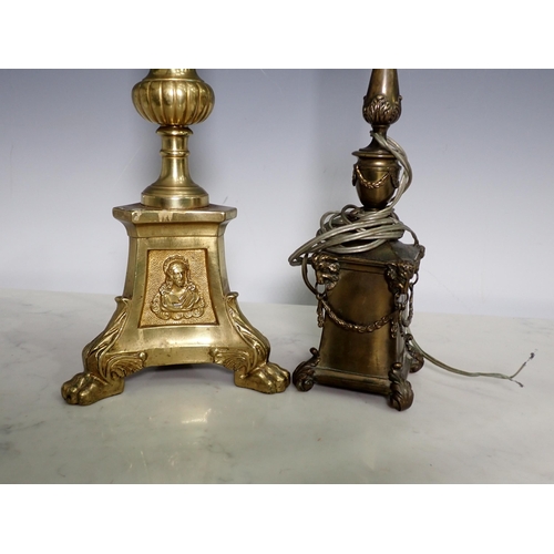 44 - A 19th Century Style brass Church Candlestick on paw feet 23