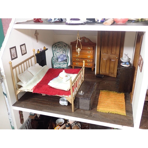 47 - A Thatched Cottage Dolls House with furniture, Garden, Veg Patch and Shed and wood store, 2ft 9