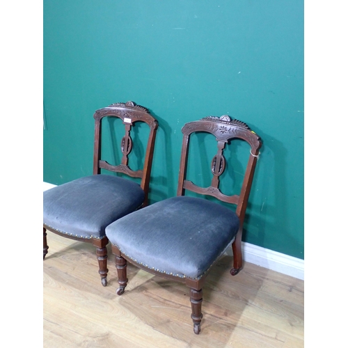 48 - A pair of Victorian Bedroom Chairs, with carved top rails, blue upholstered seats on turned front su... 