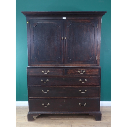 503 - A 19th Century oak Linen Press fitted two short and three long drawers to base mounted upon ogee bra... 