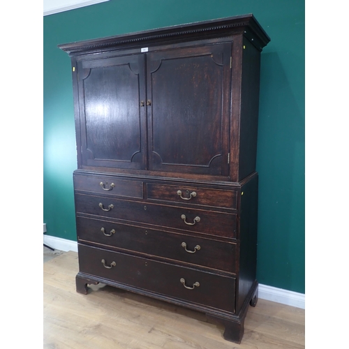 503 - A 19th Century oak Linen Press fitted two short and three long drawers to base mounted upon ogee bra... 