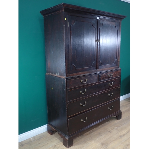 503 - A 19th Century oak Linen Press fitted two short and three long drawers to base mounted upon ogee bra... 