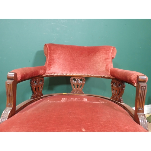 51 - A Victorian mahogany framed red upholstered Nursing Chair, and a pink upholstered Elbow Chair.