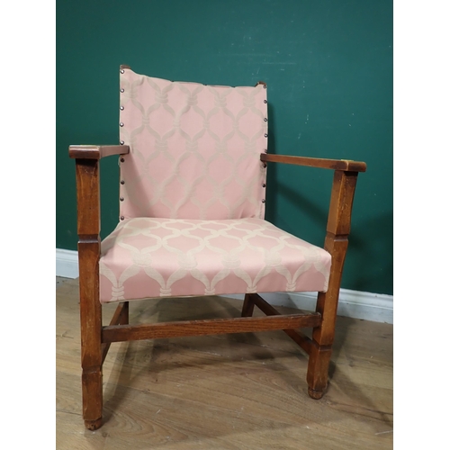 51 - A Victorian mahogany framed red upholstered Nursing Chair, and a pink upholstered Elbow Chair.