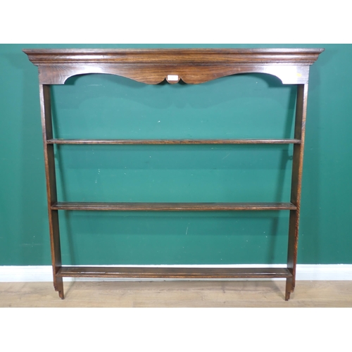 52 - An oak Plate Rack with moulded cornice and three shelves, 4ft 4