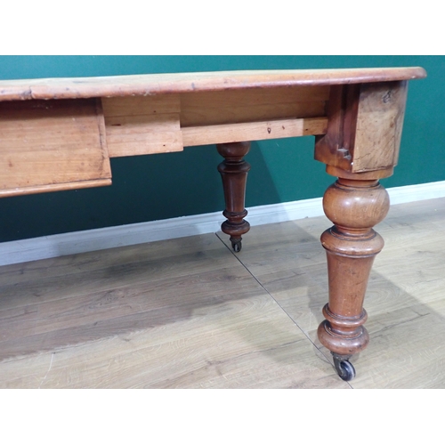 54 - An Extending Dining Table with pine top, mahogany frame, turned supports and castors, (no Winding ha... 