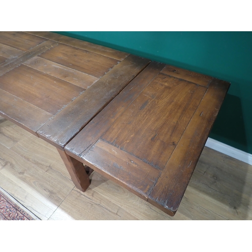 55 - An oak Refectory Table with single fitted drawer and two extension leaves, 5ft 4