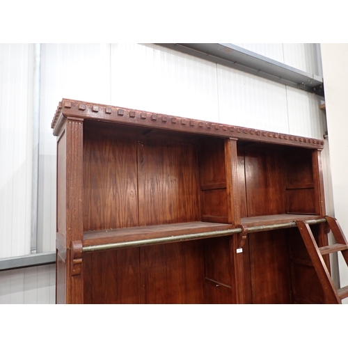 56 - A reproduction oak three section Library Bookcase & Ladder the top sections fitted with shelves, abo... 