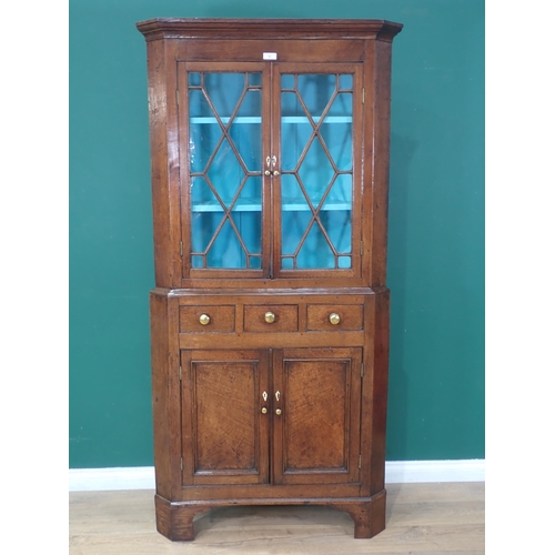 63 - A George III oak standing Corner Cabinet with glazed upper section above base fitted three drawers a... 