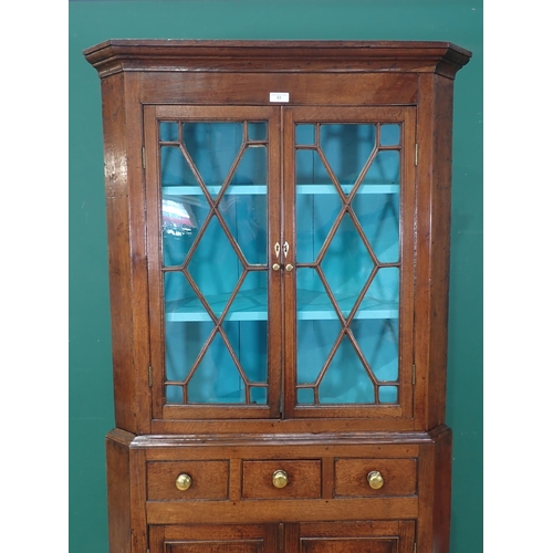 63 - A George III oak standing Corner Cabinet with glazed upper section above base fitted three drawers a... 