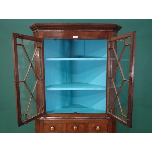 63 - A George III oak standing Corner Cabinet with glazed upper section above base fitted three drawers a... 