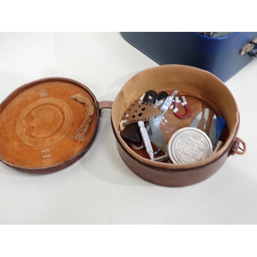 97 - A leather circular Collar Box and Contents, and a case of silver mounted Brushes, leather Wallets an... 