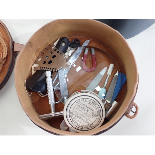 97 - A leather circular Collar Box and Contents, and a case of silver mounted Brushes, leather Wallets an... 