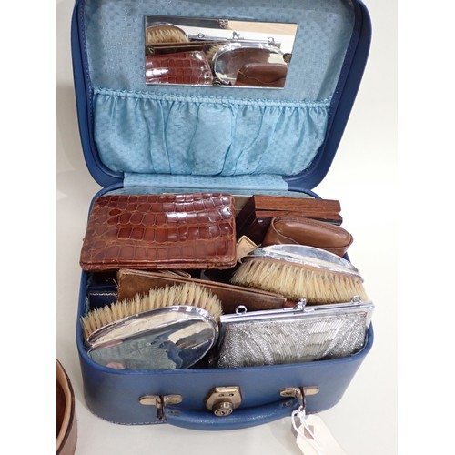 97 - A leather circular Collar Box and Contents, and a case of silver mounted Brushes, leather Wallets an... 