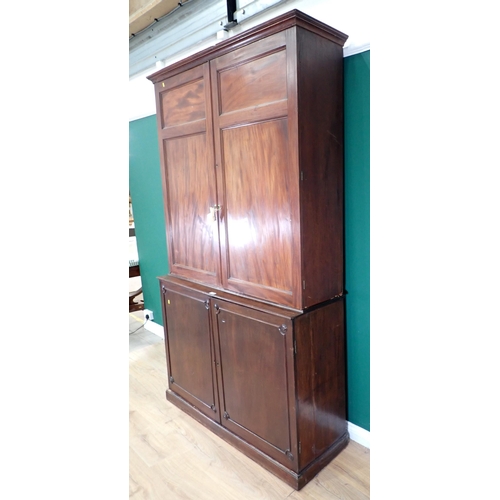 71 - A mahogany Bookcase the top section with pair of panelled doors fitted with adjustable shelves, with... 