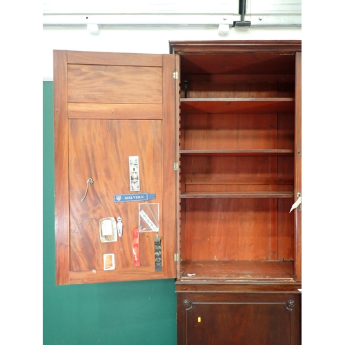 71 - A mahogany Bookcase the top section with pair of panelled doors fitted with adjustable shelves, with... 