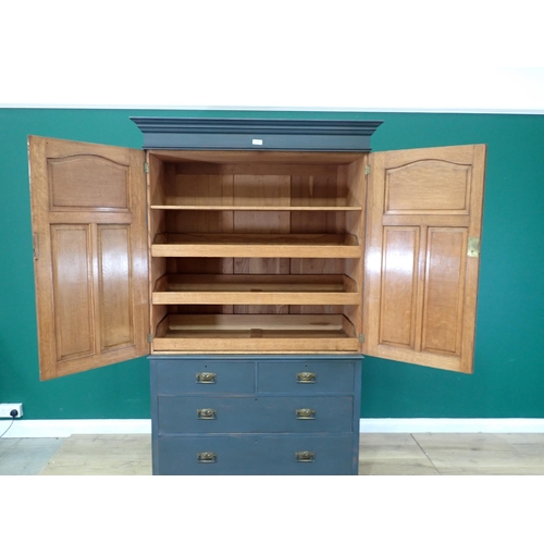 72 - A painted Oak Linen Press, the top with pair of panelled doors enclosing three slides, above a base ... 