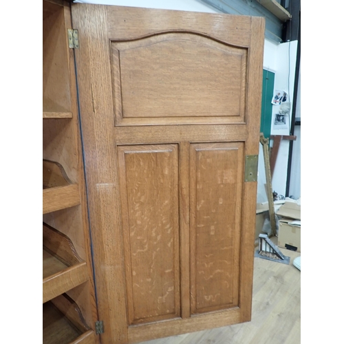 72 - A painted Oak Linen Press, the top with pair of panelled doors enclosing three slides, above a base ... 