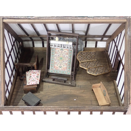 76 - A large Tudor style Dolls House, with some Furniture and three Figures, 3ft 2