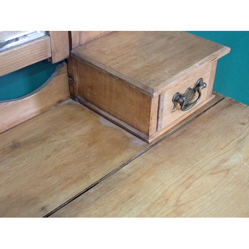 79 - A pine Dressing Chest with rectangular framed Mirror above three long drawers, 4ft 11