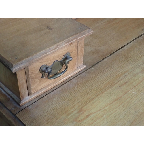 79 - A pine Dressing Chest with rectangular framed Mirror above three long drawers, 4ft 11