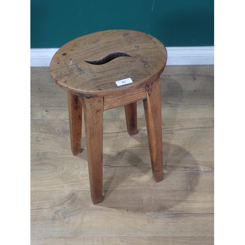 83 - An antique Dairy Stool with oval elm top mounted on oak square cut supports 1ft 9in H x 1ft 3in W