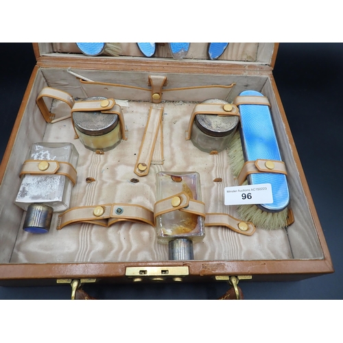 96 - A leather Dressing Case containing nine silver mounted Dressing Table Accessories, mostly with blue ... 