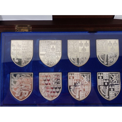 270 - A cased set of Danbury Mint ‘Royal Arms’ silver Medallic Plaques