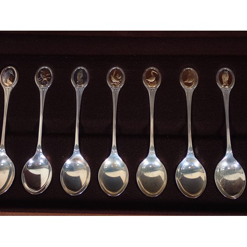 271 - A cased set of RSPB Danbury Mint hallmarked silver Spoons in fitted case with COA, along with a coll... 