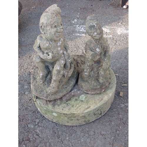 728 - Two miniature garden statues of gnomes and a grinding wheel