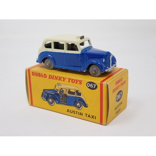 1013 - A boxed Dublo Dinky Toys No.067 Austin Taxi. Mint condition, superb box, small pencil price to one e... 