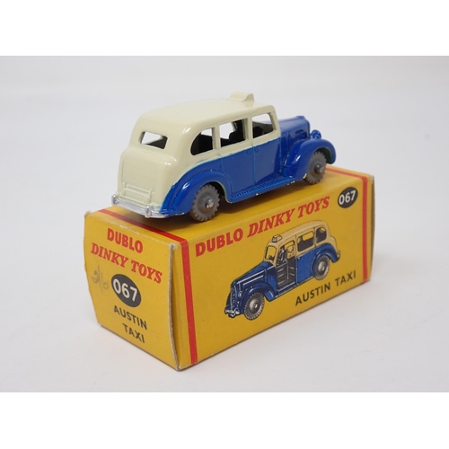 1013 - A boxed Dublo Dinky Toys No.067 Austin Taxi. Mint condition, superb box, small pencil price to one e... 