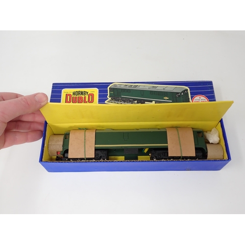 1021 - A Hornby Dublo 3233 3-rail Co-Bo Diesel-Electric Locomotive, unused and strung, boxed. Model has the... 