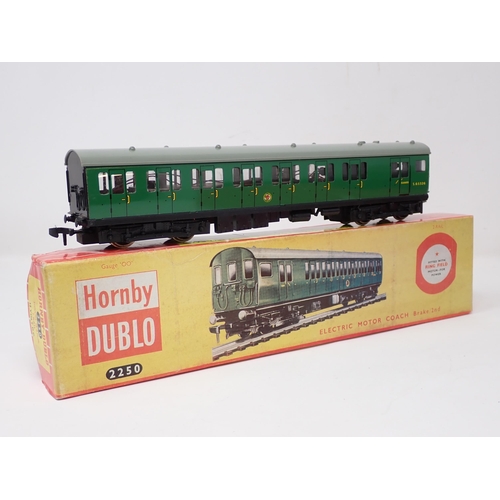 1022 - A Hornby Dublo 2250 EMU and 4081 Suburban Coach, all in Tony Cooper boxes. Models are in mint or ver... 