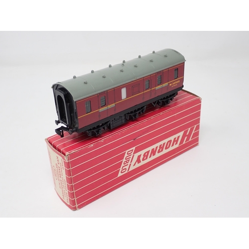 1028 - A Hornby Dublo 4076 Six-wheeled Brake Van in mint condition showing no signs of use to the wheels, b... 