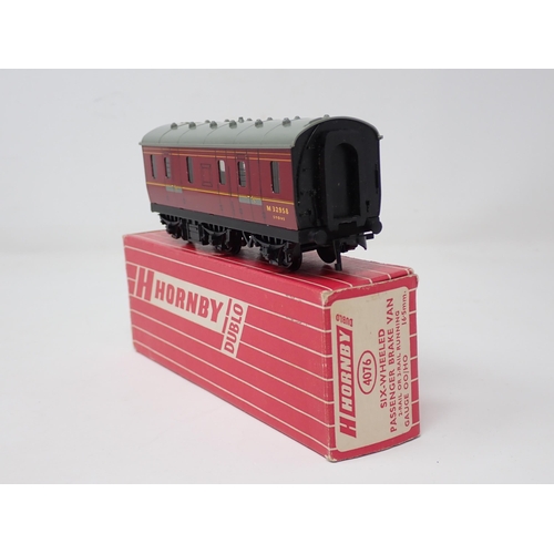 1028 - A Hornby Dublo 4076 Six-wheeled Brake Van in mint condition showing no signs of use to the wheels, b... 