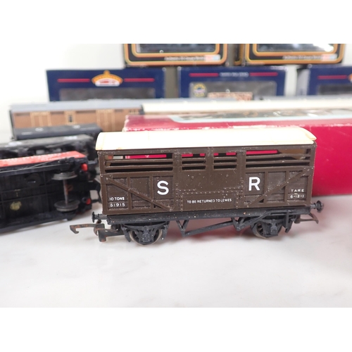 1128 - Three boxed Bachmann 00 gauge Welsh Coal Wagons, a Robbie's Rolling Stock Wagon, two boxed Mainline ... 