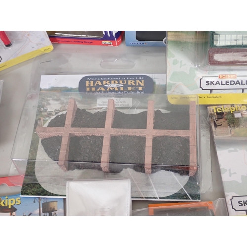 1137 - A box of 00 gauge Modelling Accessories including boxed Hornby Letter Box, Refuse Skips, Harburn Ham... 