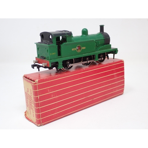 1251 - A boxed Hornby Dublo 2207 0-6-0T Locomotive in green livery with instructions and guarantee and a bo... 