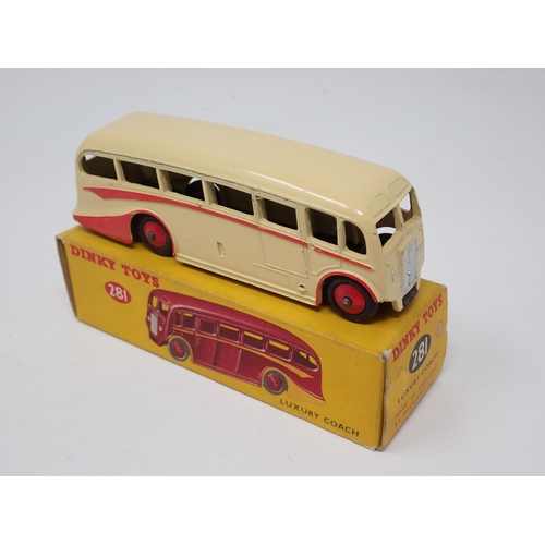 1253 - A boxed Dinky Toys No.281 Luxury Coach in cream with red flash and hubs