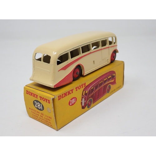 1253 - A boxed Dinky Toys No.281 Luxury Coach in cream with red flash and hubs