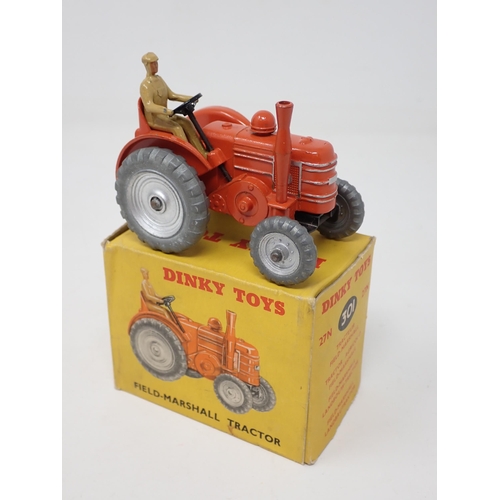 1254 - A boxed Dinky Toys No.301 Field-Marshall Tractor with silver hubs