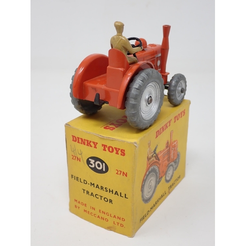 1254 - A boxed Dinky Toys No.301 Field-Marshall Tractor with silver hubs