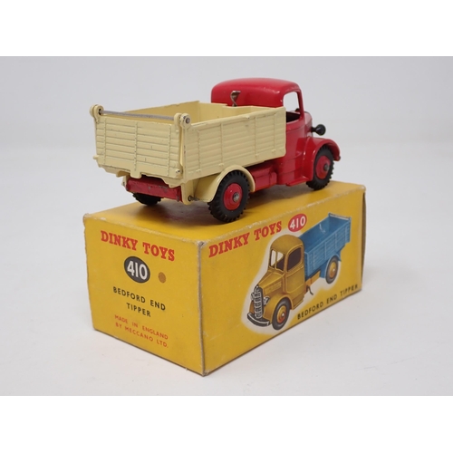 1258 - A boxed Dinky Toys No.410 red and cream Bedford End Tipper