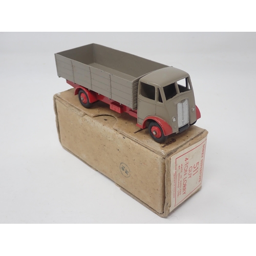 1308 - A boxed Dinky Toys No.511 Guy 4-ton Lorry with fawn body and cab and red chassis