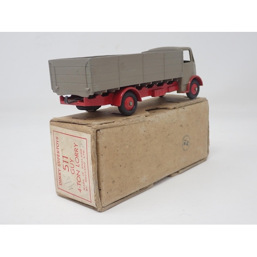 1308 - A boxed Dinky Toys No.511 Guy 4-ton Lorry with fawn body and cab and red chassis