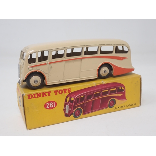 1312 - A boxed Dinky Toys No.281 Luxury Coach in cream with red flash and hubs