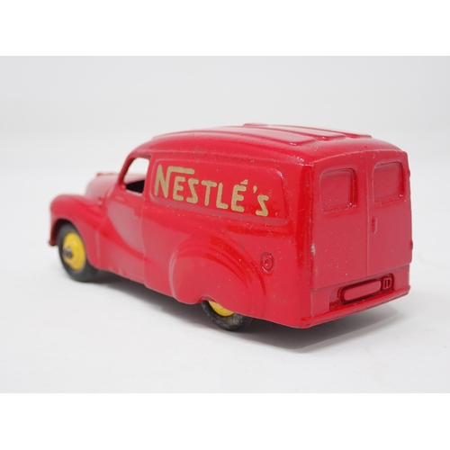 1324 - A boxed Dinky Toys No.471 Austin 'Nestle' Van